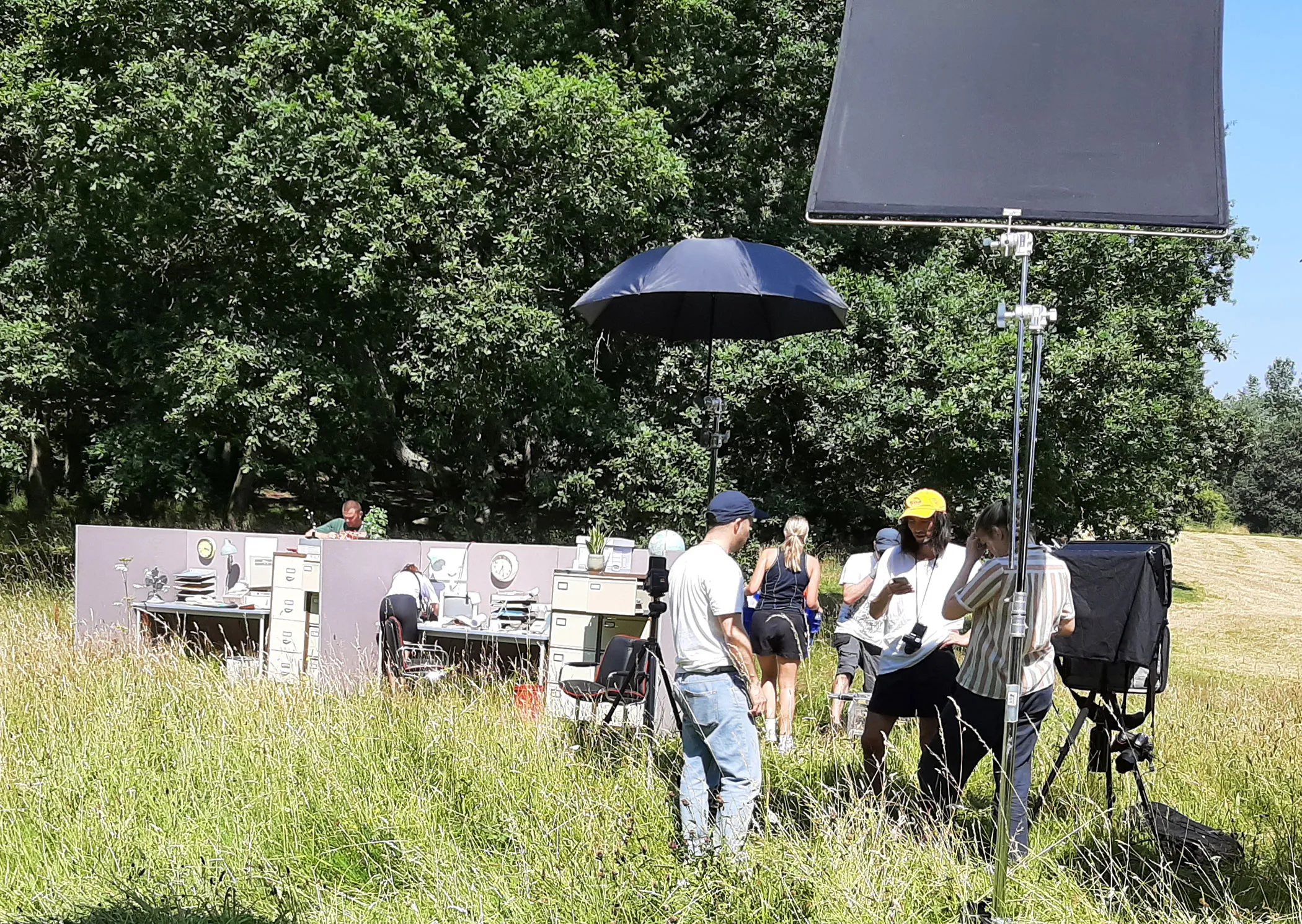 A group of people standing in a field.